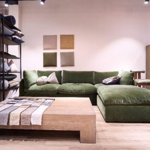 Green velvet sectional sofa in THG showroom